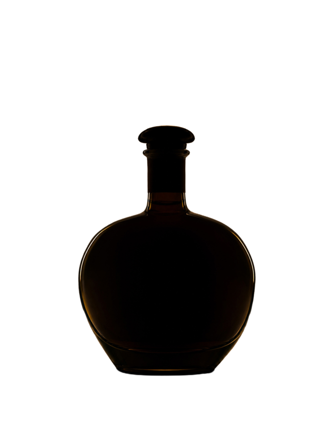 The Laird's 250th Anniversary 13-year-old apple brandy decanter, lit against an American flag